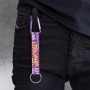 Purple Lithuania keychain attached to jeans