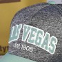 Gray speckled baseball cap with green visor Las Vegas