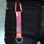 Red Lithuania keychain attached to jeans