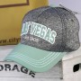 Gray speckled cap with green visor Las Vegas